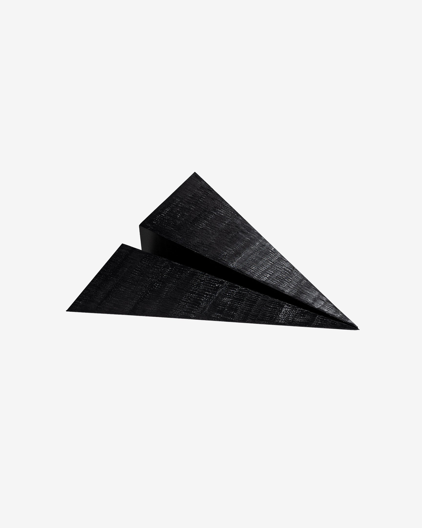 Shadow Run 24 inch black paper plane sculpture by Griffin Loop