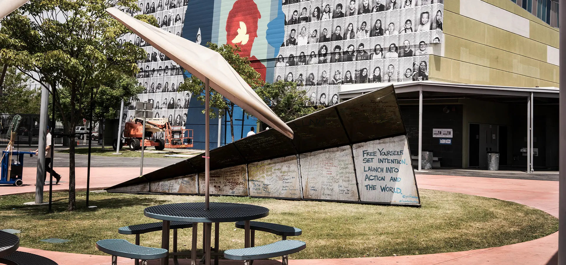 The Dr. Maya Angelou Mural Festival activation of Launch Intention's Metal Paper Plane sculpture in the courtyard of the Community High School in Los Angeles, California.
