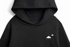 Detail view of Keep Your Head In The Clouds x SF hoodie graphic and paper plane artwork