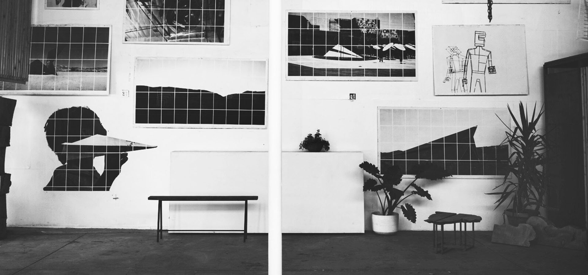 Gallery wall of Launch Intention imagery and prints at a Venice International Airport Studio activation.