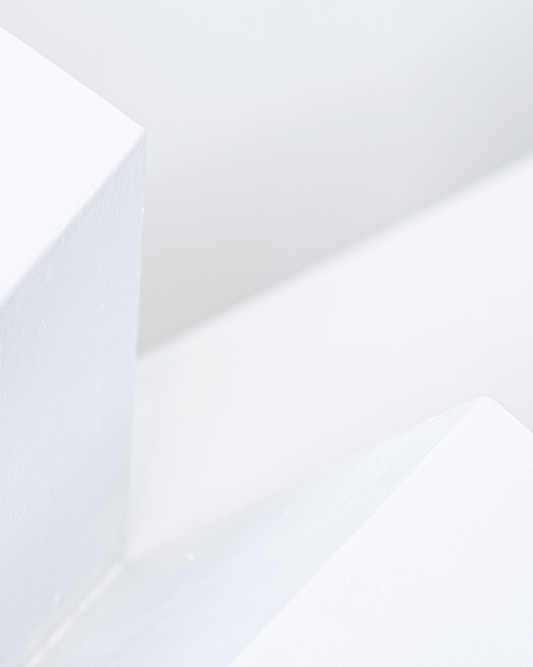 White Space 24 inch all-white paper plane sculpture by Griffin Loop
