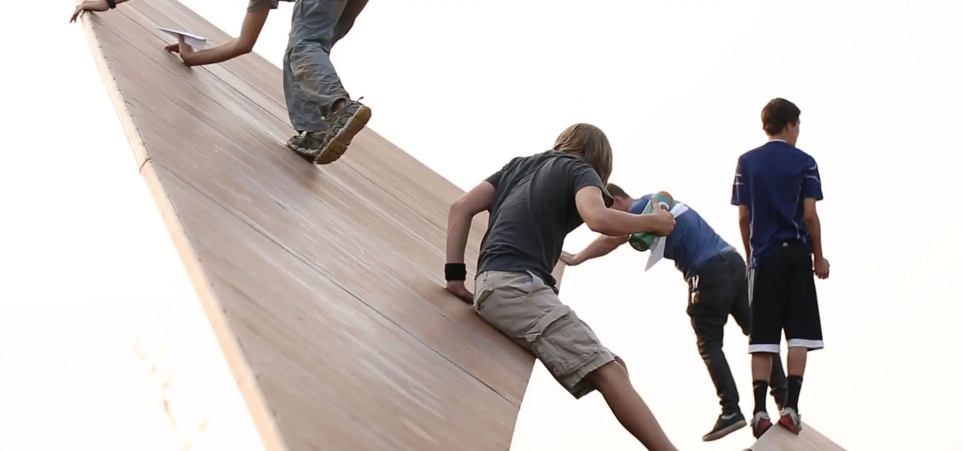 Children playing on the original Launch Intention activation at the 50ft Paper Airplane sculpture at Powder Mountain Utah.