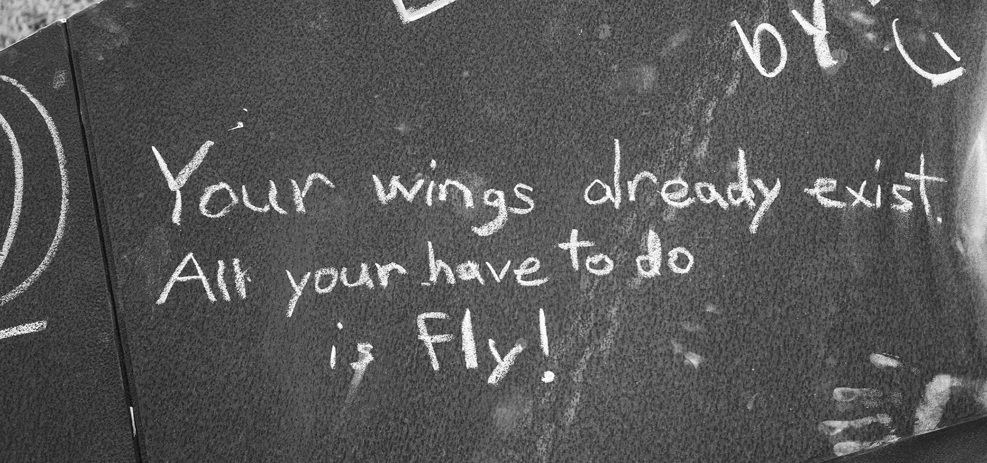 An intention written on the Paper Airplane sculpture, "Your Wings already exist. All you have to do is fly!"