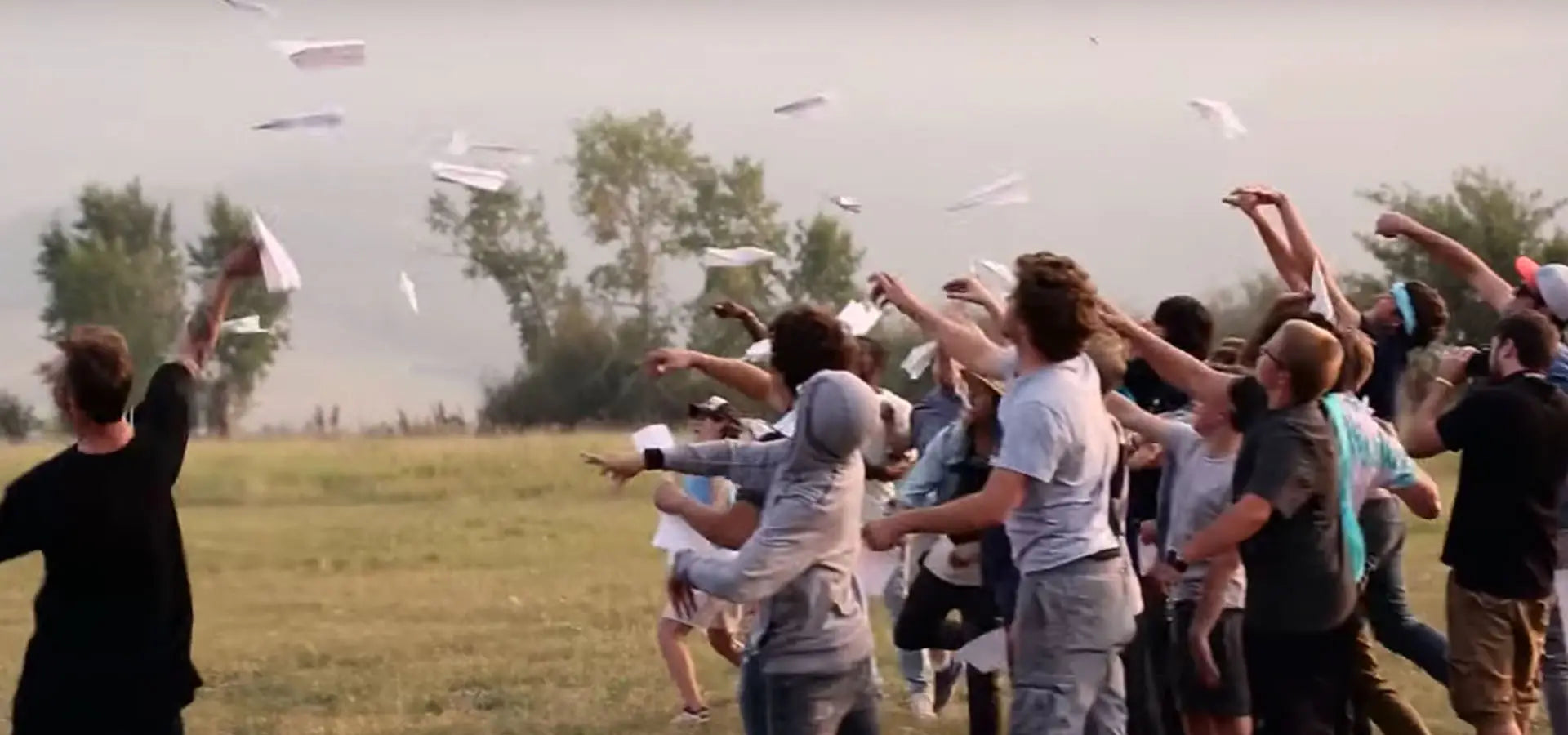 Launch Intention founder & artist Griffin Loop launches paper airplanes with students during an activation at Powder Mountain, Utah.