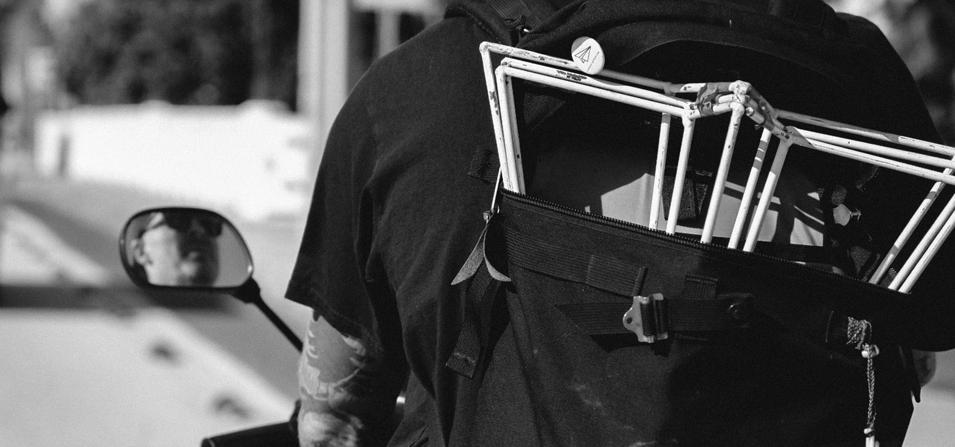 Artist Griffin Loop rides a moped to Context Art Miami with a back pack full of Paper Airplane sculptures and a Launch Intention button for Art Basel.