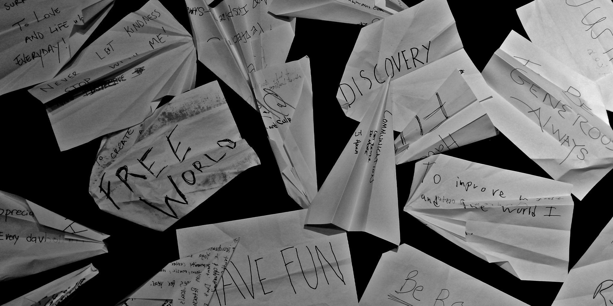 A collection of Launch Intention activation Paper Airplanes with intentions written on them.