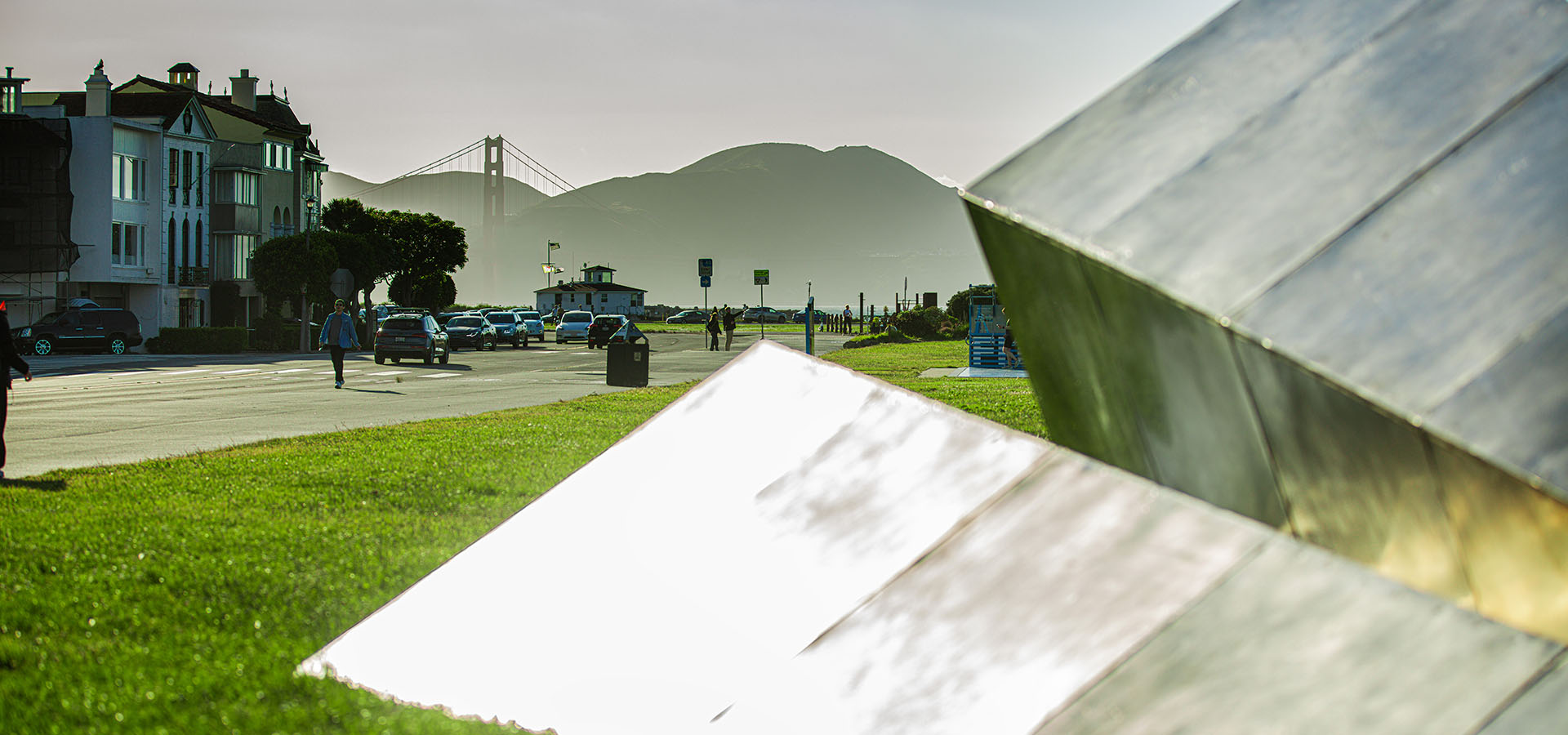 The Launch Intention 25 Ft Paper Airplane sculpture beaming in sunlight on the Marina Green Triangle opening with the Golden Gate Bridge in the background.